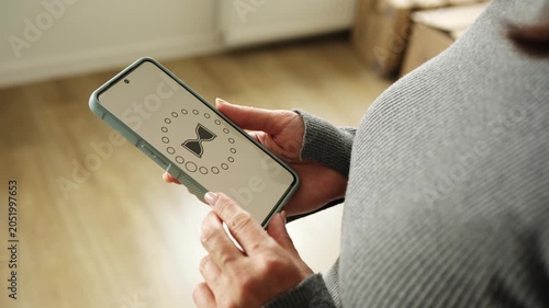 Girl Waiting For Smartphone And Internet Loading With Rotating Hourglass Icon