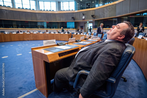 A satirical look at an imaginary politician sleeping in the plenary hall