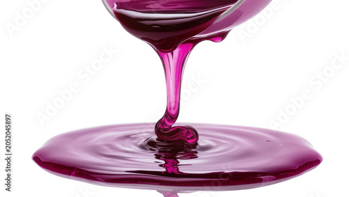Фотография Viscous purple liquid pouring from glass creating ripples, isolated on transpare