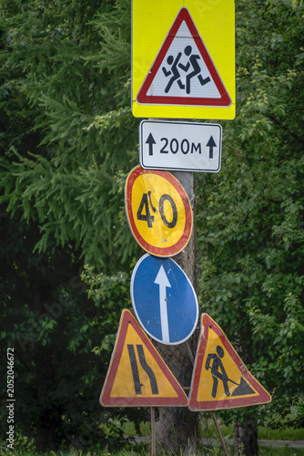 Road signs at the repair site on a summer day