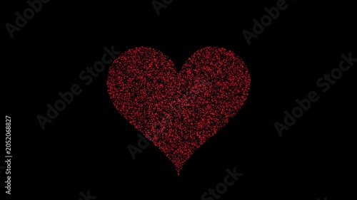 Red glowing particles forming and dissolving into a beautiful heart shape on black background