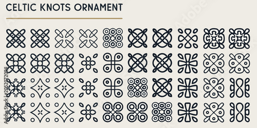 Foto Collection of twenty four black celtic knot ornaments on a cream colored backgro