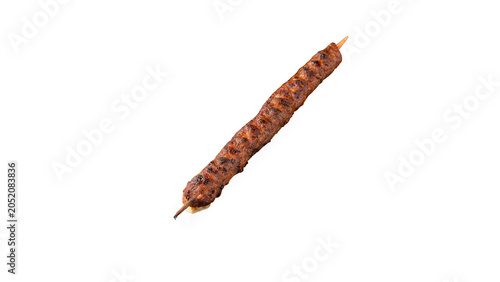 Foto Single crispy brown breadstick or thin savory snack stick isolated on dark