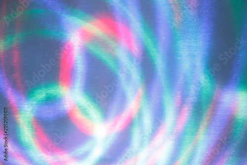 Cuadro en lienzo Abstract colorful light streaks on a fine textured grid background