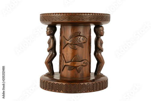 A hand carved wooden stool featuring traditional african tribal figures and fish motifs in a dark brown finish isolated on a black background