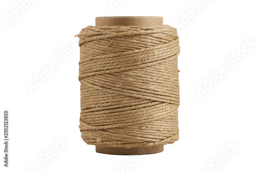 A single spool of thick brown jute twine wrapped tightly around a cardboard cylinder, isolated on a white background, for craft projects