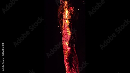 Close up of a fire log burning with sparks