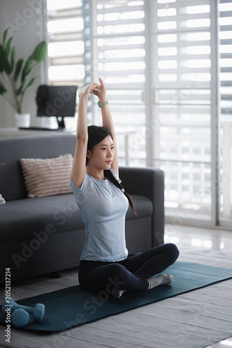Fotografie Young asian woman attractive exercises workout at home