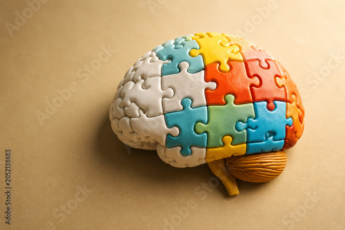 AI generated brain formed from colorful puzzle pieces symbolizing cognition memory learning mental health problem solving intelligence neurological development