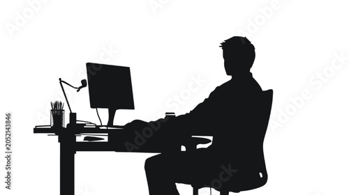 Businessman sits at a desk while working on a desktop computer in this professional office environment.