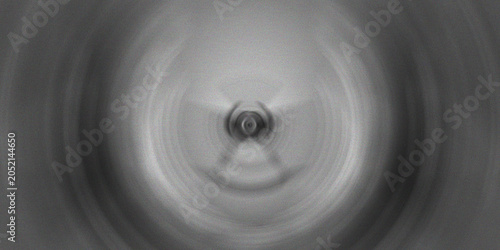 Bild auf Leinwand Monochromatic radial blur effect creating concentric circles with a central focal point