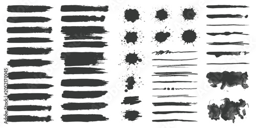 Set of black ink brush strokes and paint splatters for artistic design projects and creative graphic elements