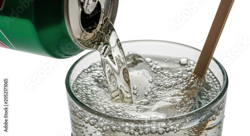 Refreshing carbonated soda being poured from a green can into a glass isolated on transparent background