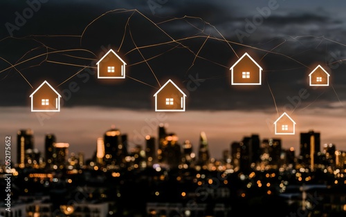 Glowing Digital Real Estate Icons Floating Above a Modern City Skyline at Dusk