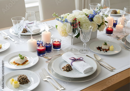 Elegant dinner party with white flowers candles and fine china on a wooden table indoors