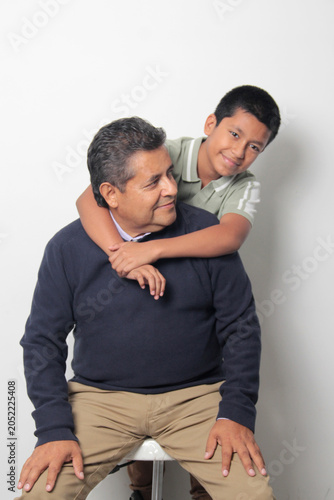 Latino single dad and his 12-year-old Latino son show their love to celebrate Father's Day