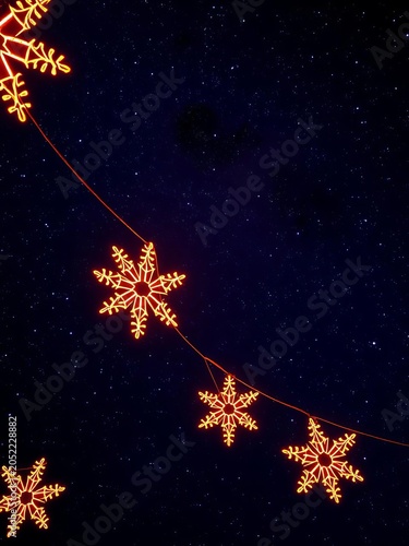Celestial decorations aglow against a starry night sky, present, gift