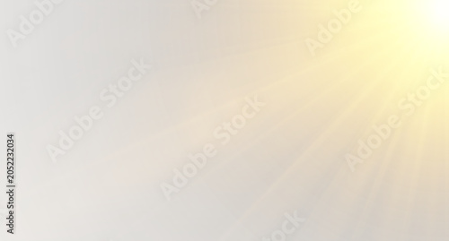 Photos Golden sun rays and soft lens flare from the right corner on a light grey backgr