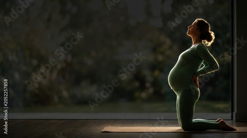 Pregnant Woman Practicing Yoga in Minimalist Space with Natural Sunlight