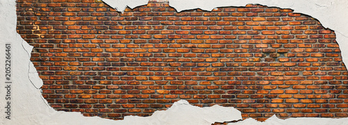 old brick wall with destroyed plaster, brickwork texture
