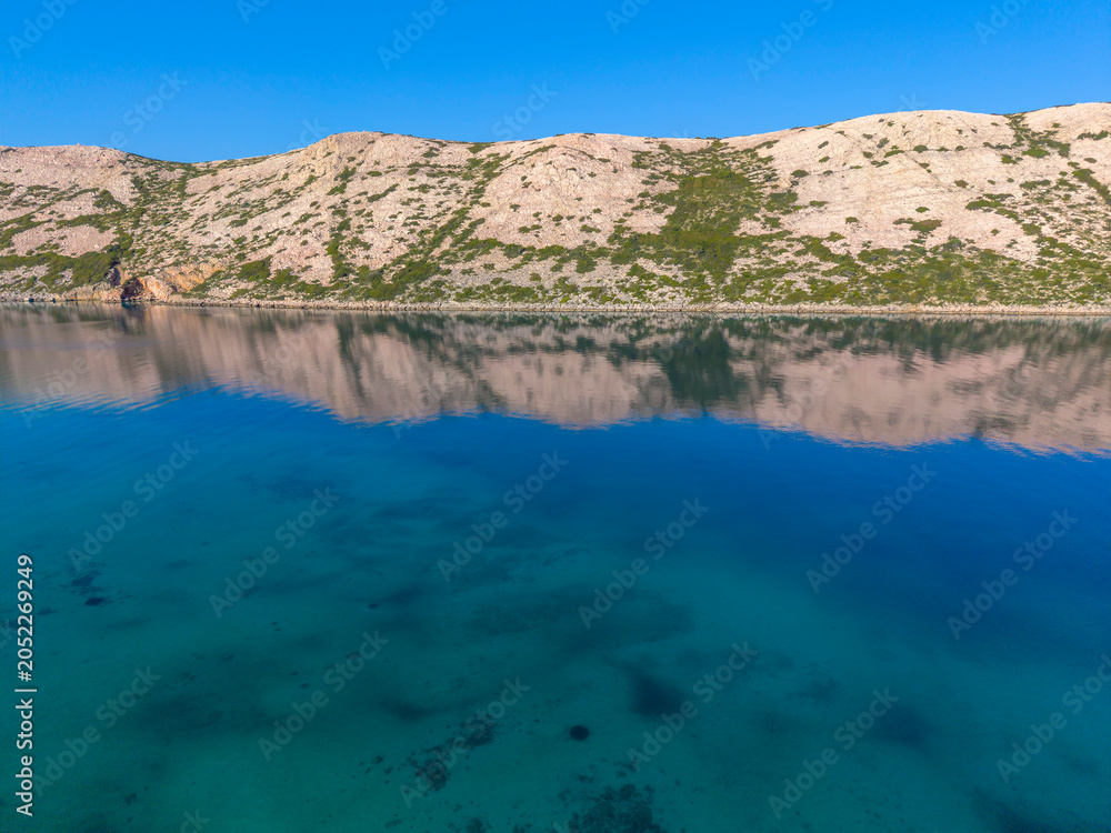 Fototapeta premium Rugged Coastline of Rab Island Reflected in the Adriatic Sea, Croatia