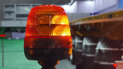 Emergency light on a vehicle in a garage during evening work hours
