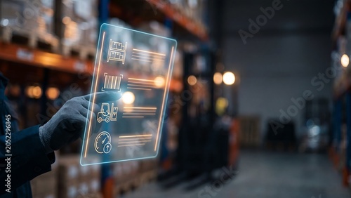 Worker using holographic screen with warehouse inventory icons showing logistics management supply chain tracking smart storage barcode system and digital distribution technology concept