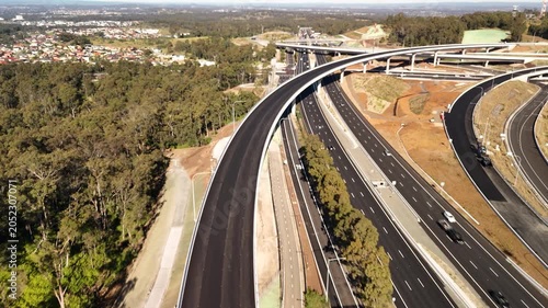 Aerial drone view above the M7 -M12 Interchange at Cecil Hills, Western Sydney, NSW Australia on a sunny morning in June 2026