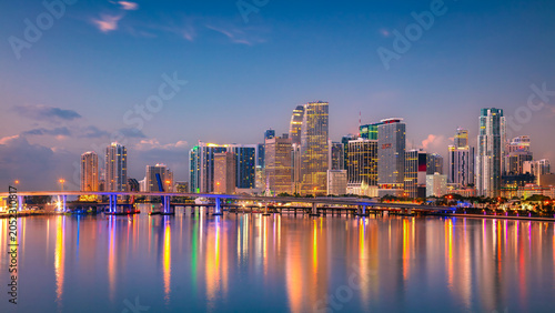 Miami, Florida, USA. Aerial cityscape image of Miami, Florida with reflection of the city skyline in the water at beautiful sunrise.