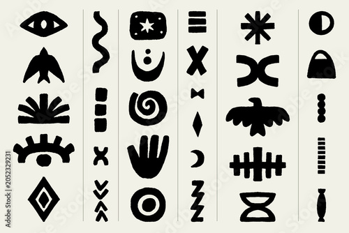 set of hand drawn tribal symbols and elements