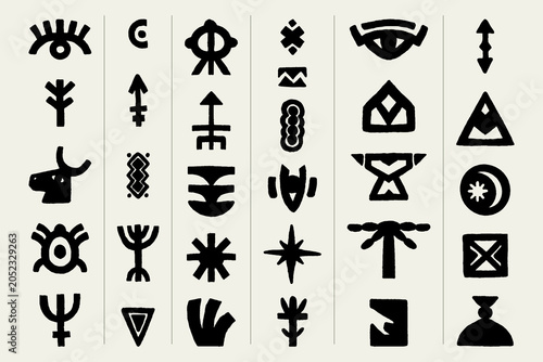 Fotografie set of hand drawn tribal symbols and elements