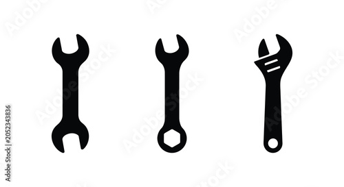 Photos Three black silhouette wrenches on a white background a set of tool shapes