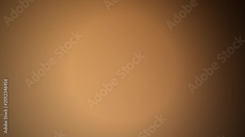 Abstract warm gold and brown blurred radial gradient background template in horizontal orientation