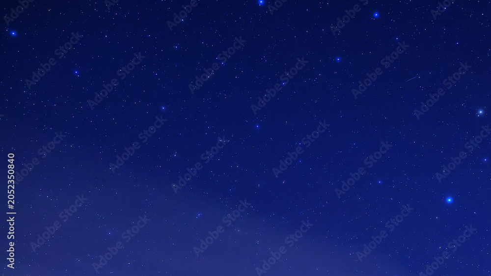 Obraz premium Constellations and Milky Way stars on a dark countryside skies.