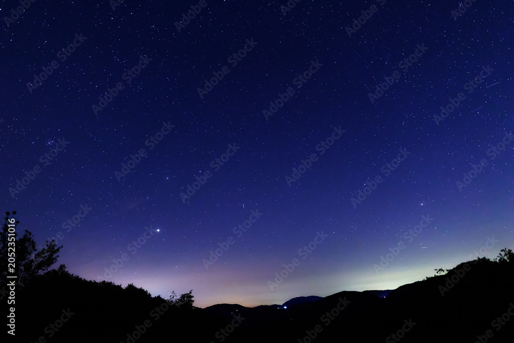 Obraz premium Constellations, landscape, Milky Way stars on a dark countryside skies.