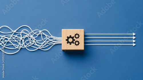 Tangled wires entering wooden block with gears and exiting as straight arrows representing problem solving and process optimization
