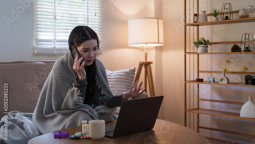 Konstfotografi Asian woman feeling unwell talking on phone with laptop for telehealth