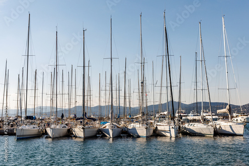 Sailboats and luxury yachts moored in St Tropez harbor, France