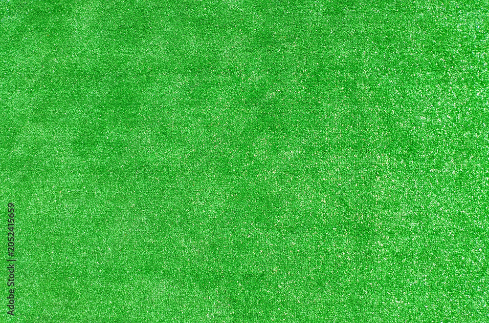 Fototapeta premium Green lawn, emerald grass, green artificial grass, various shades of green, natural backdrop for eco-friendly design projects