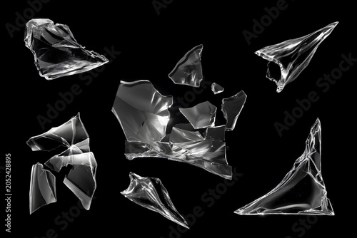 Fotografie Set of realistic shattered glass fragments isolated on black background, collect