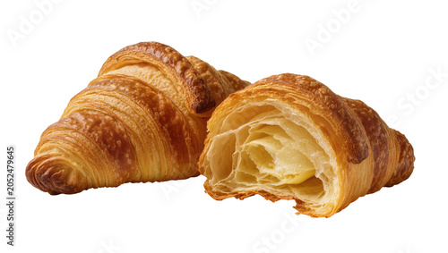 Bild auf Leinwand Golden brown croissants one whole, one cut in half showing flaky layers