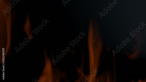 A burning flame on a black background, isolated for video compositing and special effects.