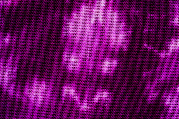 Macro view of purple tie dye fabric texture