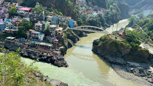 Wide-angle landscape of Devprayag where the Alaknanda and Bhagirathi rivers unite to form the Ganges.