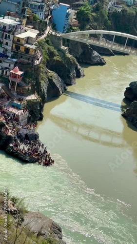 Spectacular confluence of the Alaknanda and Bhagirathi rivers at Devprayag, forming the sacred Ganga River in Uttarakhand, India.