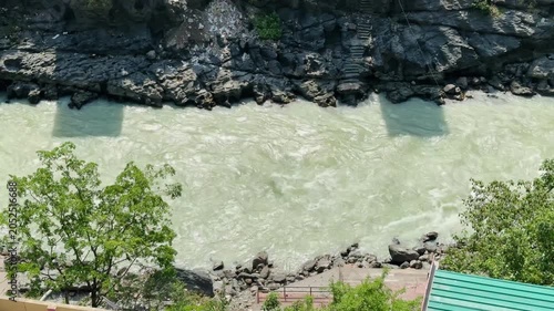 Alaknanda River flowing through rocky terrain in Devprayag region in the Himalayan region of Uttarakhand, India.