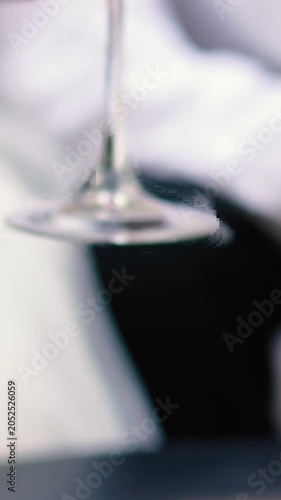 A summer alcoholic purple drink served with ice during a romantic date between a man and a woman. A close-up of lemonade for freshness.