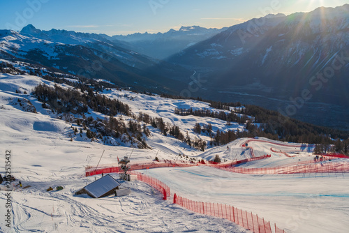 Fényképezés Sunrise over the Rhone Valley with snow-covered mountains and part of the men's