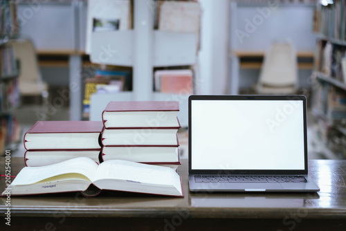 Laptop and Stack of Books on Library Table – Modern Education, Digital Learning and Academic Research Concept
