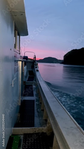 Boat Wake at Sunset with Pink and Purple Sky, Vertical Ocean Travel Background 05